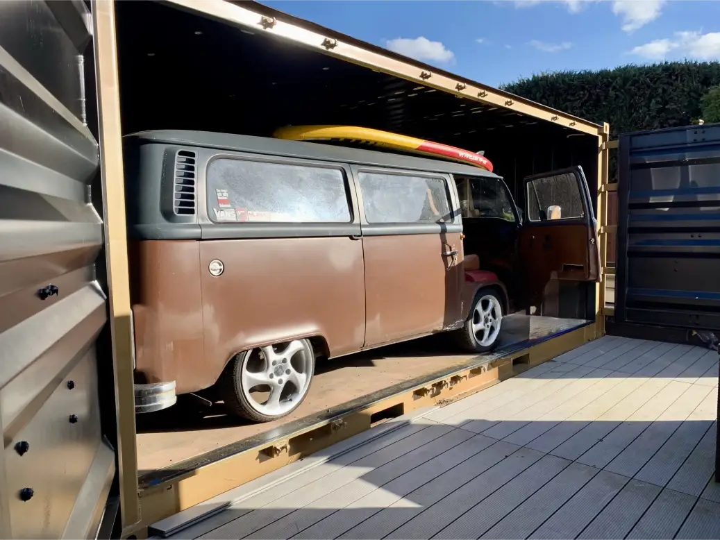 Classic VW T2 camper parked inside a 20ft side door shipping container