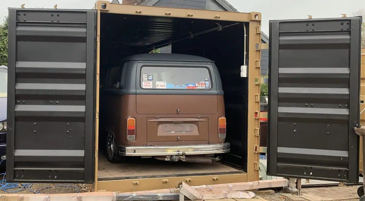 20ft side door shipping container used as a private garage for a classic VW camper