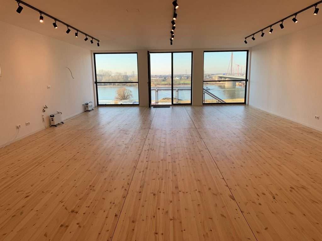 Bright meeting room with large windows inside three joined 40ft high cube containers