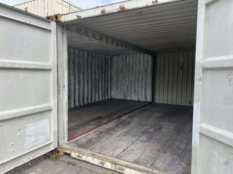 Inside two joined shipping containers with the side walls removed