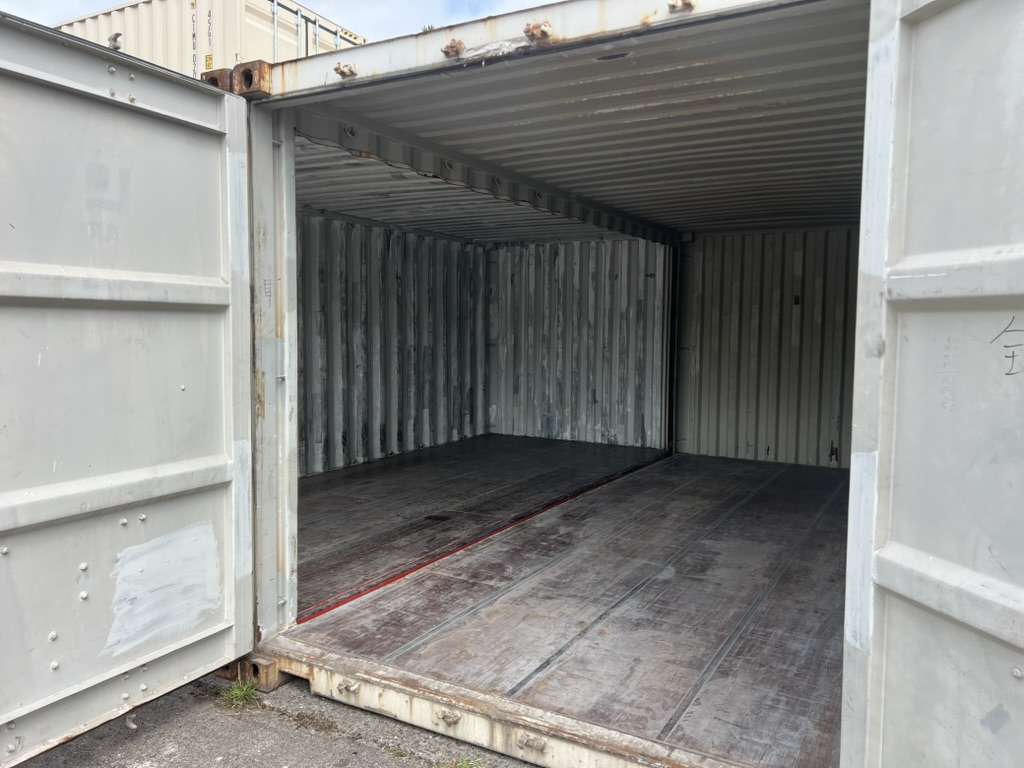 Inside view of two joined shipping containers forming one room just under 16 feet wide