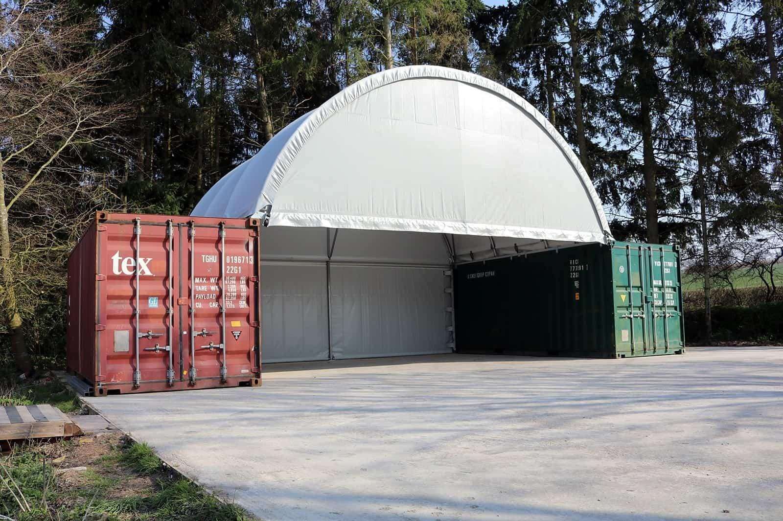 Container farm shelter with a covered drive-through area