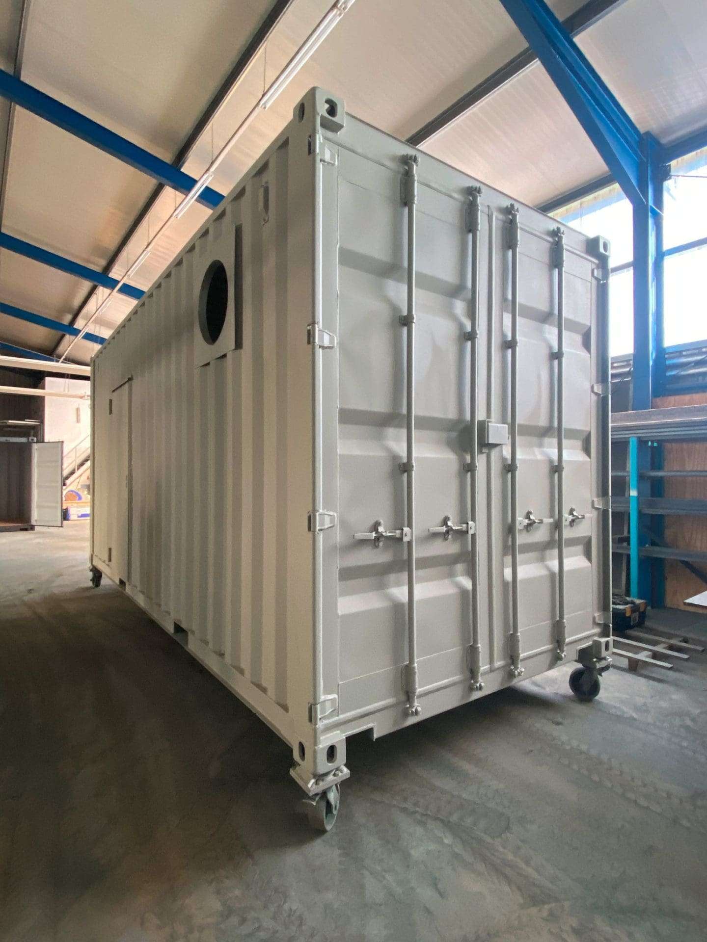 Three joined high cube containers forming a technical housing unit in the workshop