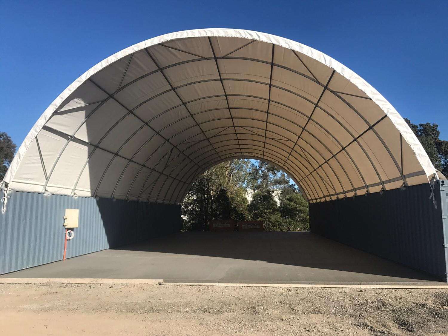 Covered drive-through area of the container hay shelter