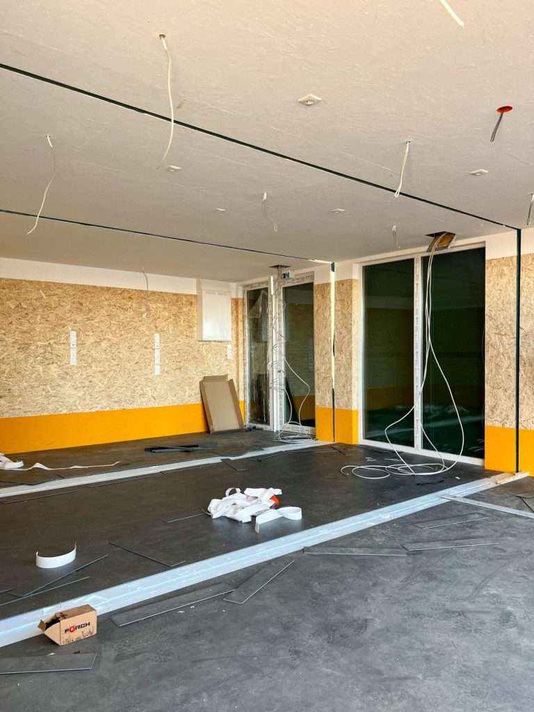 Container classroom during fit-out with floor-to-ceiling windows