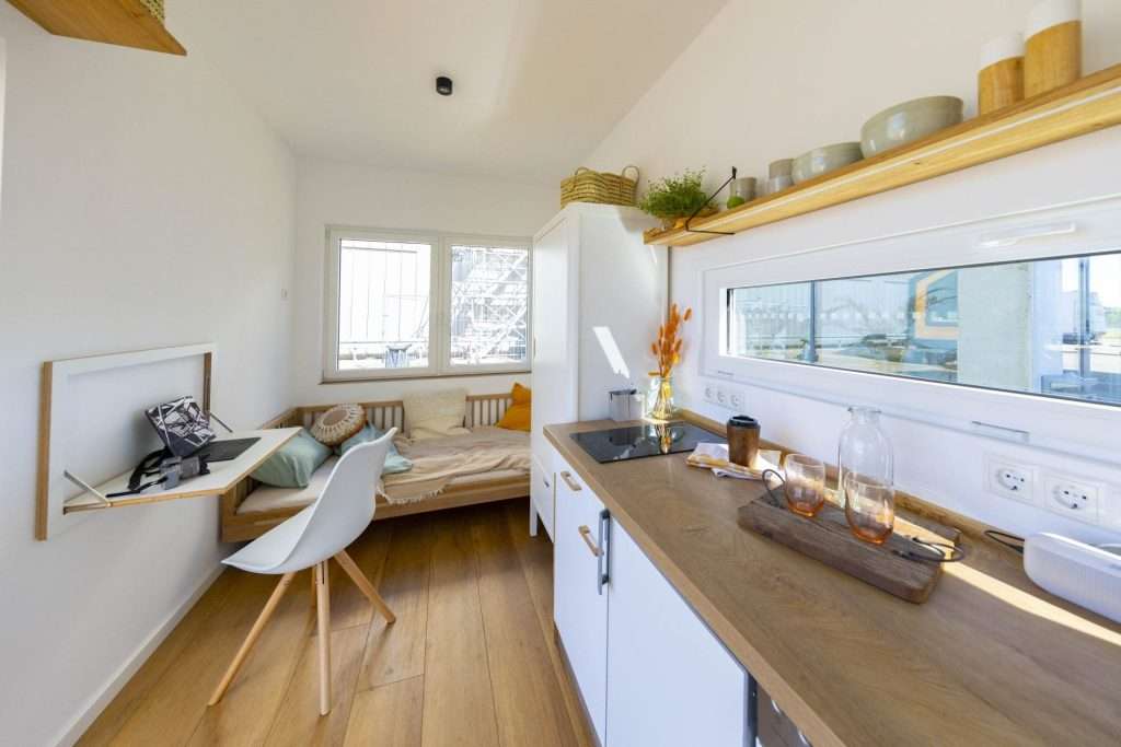 Living area and kitchen inside the 20ft high cube tiny home